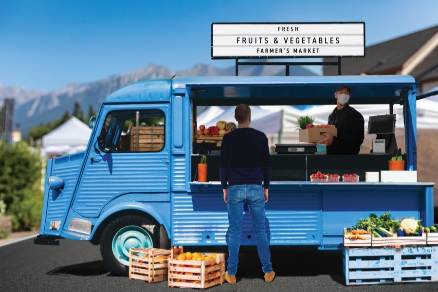 POS scale and POS setup at a farmer's market food truck.