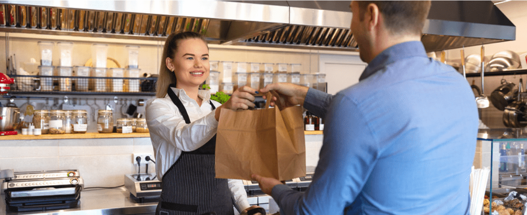 Customer Picking up Food from Restaurant