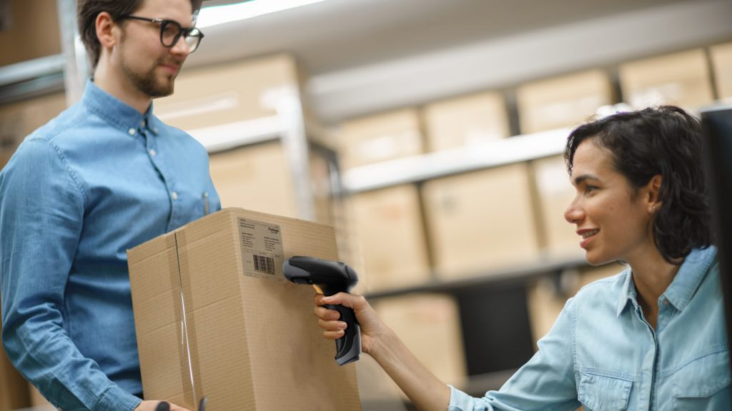 Woman scans inventory with wireless barcode scanner by Star Micronics.